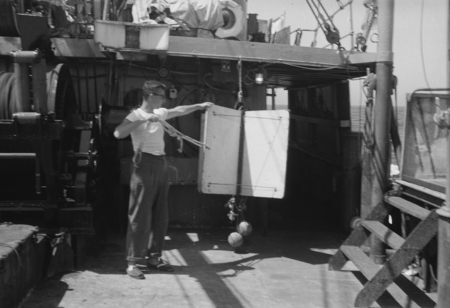 [John Knauss with oceanographic instrument aboard R/V HORIZON]