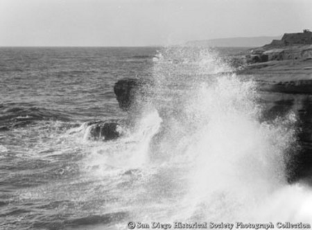 Ocean waves crashing on to rocky coast