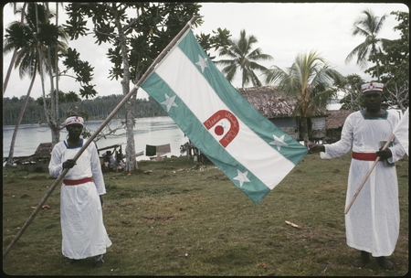 Christian Fellowship Church members holding a flag