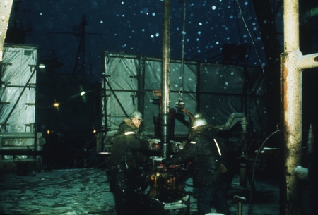 [Men in parkas work on drill rig on icy deck of D/V Glomar Challenger] Antarctica, Leg 28