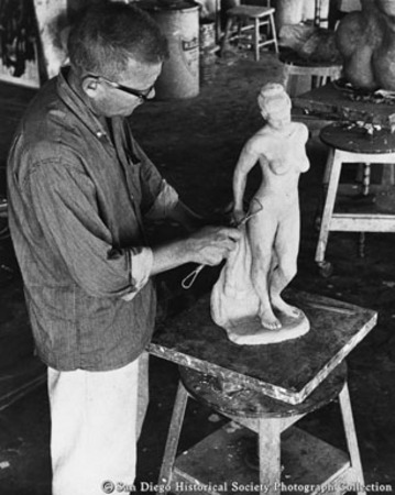Sculptor working with material containing agar, American Agar Company