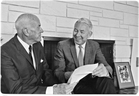 Ernest Mandeville, left, and Chancellor John S. Galbraith discuss the Mandeville Lecture Series