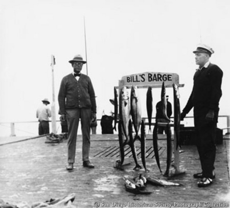 Two men posing with catch of fish on Bill&#39;s Barge