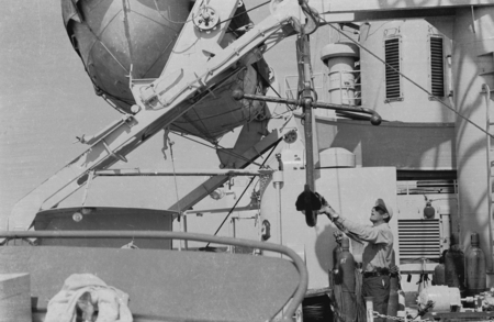 [Man with instrument on deck of R/V SPENCER F. BAIRD]