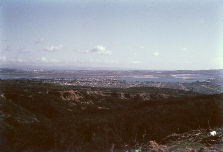 A view of the San Diego harbor from the hill tops of San Diego, possible from Point Loma. 1950.