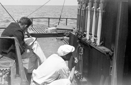 Roger Revelle (writing) and Richard Howell Fleming on the deck of R/V Scripps