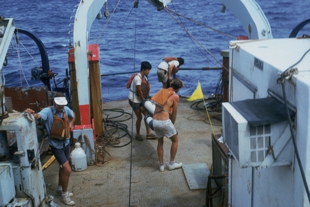 Oceanographers putting out long seismic array. Onboard R/V Thomas Washington, Indopac Expedition. July 21, 1976