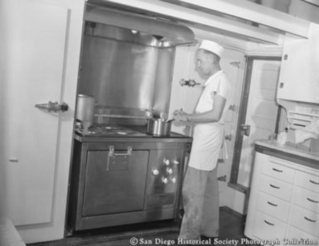 Cook in galley on board tuna boat South Coast