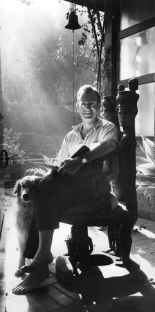 Walter Munk seated at home, with his dog Arthur