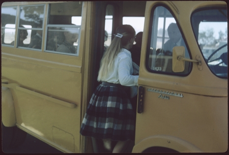 Female student getting on UCSD&#39;s first and only school bus