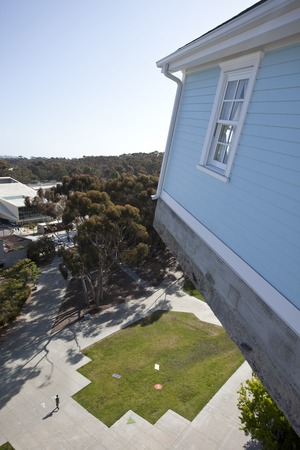 Fallen Star: wide-angle view of house cantilevered out, seven stories off the ground, plaza below and eucalyptus groves in...
