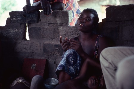 Storyteller inside an nsaka at Nsama village