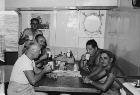 Crew members entertain themselves in the mess hall of R/V Horizon