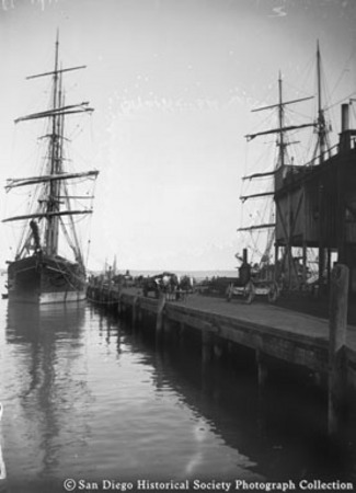 Sailing ships docked at pier on San Diego waterfront