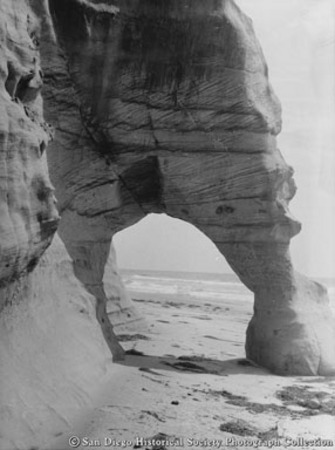 Rock archway on San Diego beach