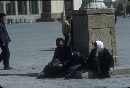 Women and Child Resting on Tian An Men Square