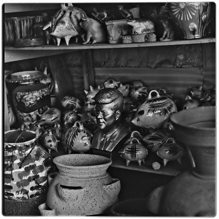 Flower pots, figurines and plaster bust of John F. Kennedy