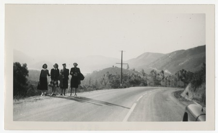 Mary, Lilian, Lila, and Joan Fletcher standing on road shoulder