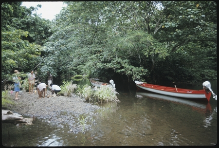 People at river bank, with boats