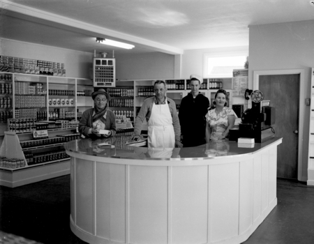 Opening of the Rite Price Market, Manager George Ludy and family behind counter. Man-around-town George (Smitty) Smith on ...