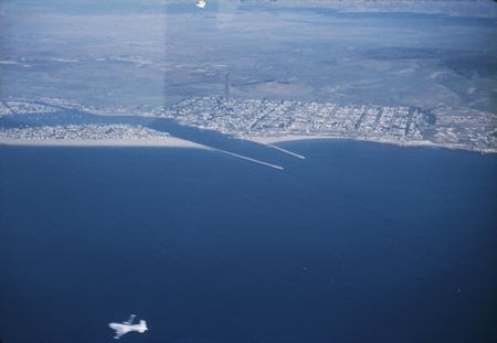 Aerial view of Newport Beach, California, jetties and the surrounding area near the beach. January 1952.