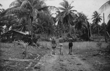 Three unidentified men on a jungle road on Bikini Island, this photo was taken by a member of the Capricorn Expedition (19...