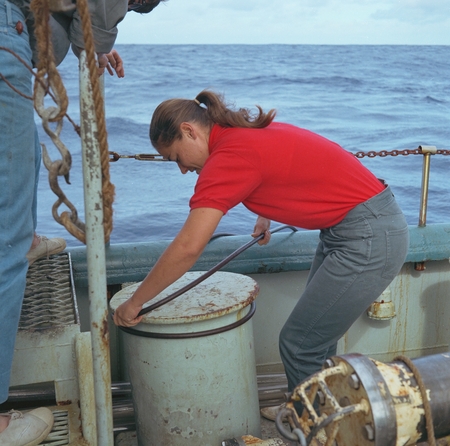 Geophysical specialist Helen K. Kirk with hydrophone cable on deck of Scripps Institution of Oceanography&#39;s research ship ...