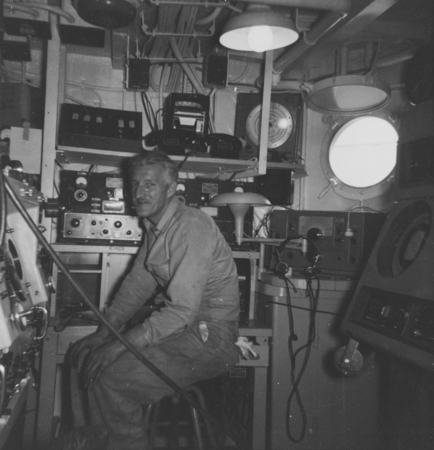 Radio Operator Nick Carter in Radio Room, R/V Horizon, MidPac Expedition