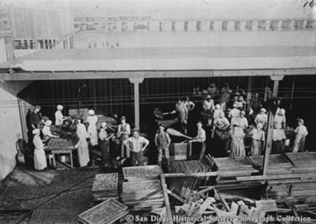 Employees posing outside of Normandy Sea Food Company cannery