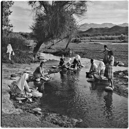 Women washing clothes in a stream in the Batuc area