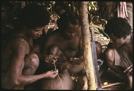 Men exchanging betel for kofu shell money.