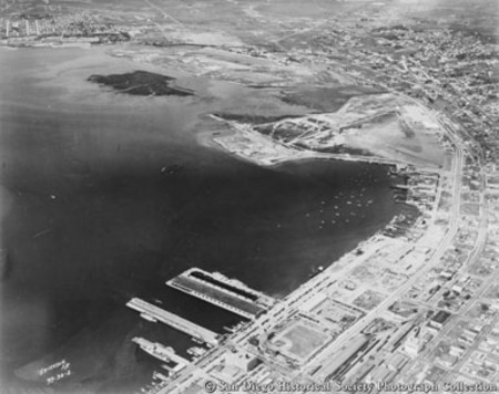 Aerial view of San Diego harbor showing B Street, Broadway, and Navy piers