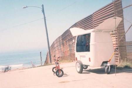 Toaster Work Wagon: wagon situated by U.S. - Mexico border fence