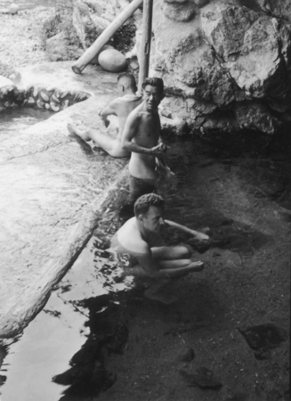Robert S. Dietz bathing near waterfall, Japan