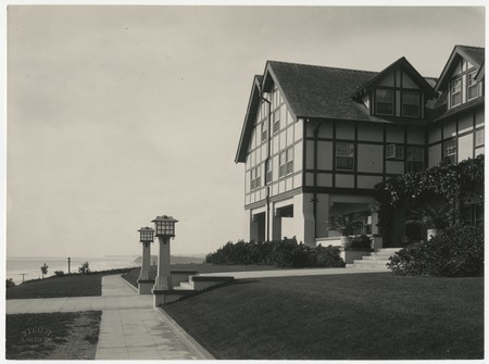 Exterior view of Stratford Inn with steps and light posts