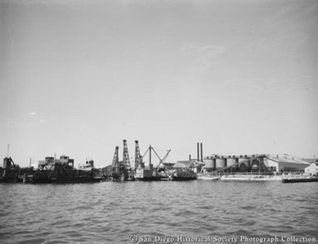 General view of San Diego waterfront showing Kelco kelp cutter Elwood and Sun Harbor Packing Corporation tuna cannery