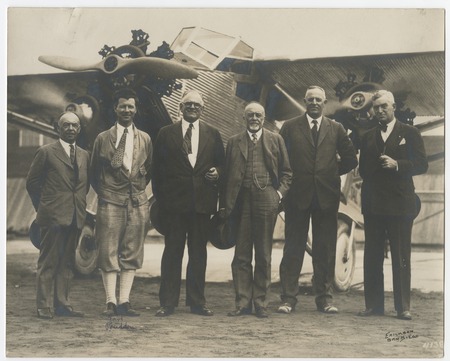 Ed Fletcher, George Prudden, and others in front of airplane