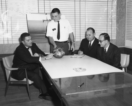 Bit Trouble - Three Tenneco officials listen to Project Manager K.E. Brunot, second from left, describe how chert and flin...