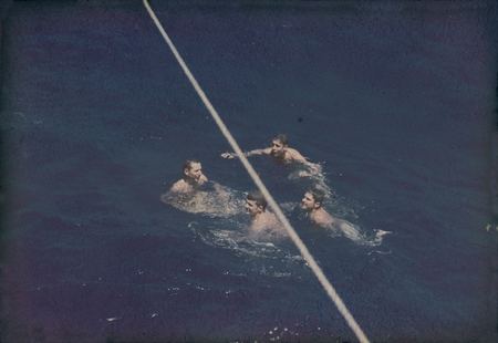 Robert Dill, Roger Revelle and group swimming off the side of the research vessel Horizon during the MidPac Expedition (19...
