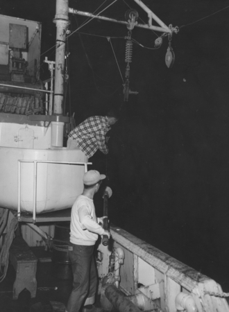 Robert L. Fisher above and Nori Nasu below, taking gravity core