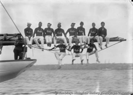 Crew of John D. Spreckels&#39;s yacht Lurline sitting on jib boom