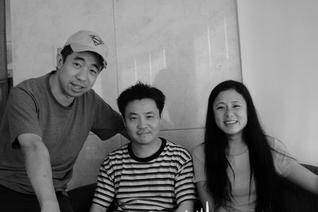 Yu Hua with Yu Jie and Xiaojian in Beijing hotel coffee shop