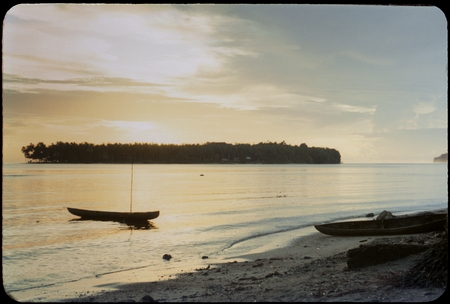 Coastal landscape with canoes