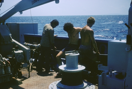 Straightening the heat probe: Yoki, Randy, Bob. Onboard the R/V Thomas Washington, Indopac Expedition. September 13, 1976