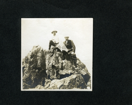 Crew members on some rocks on the Los Coronados Islands with an American flag during the expedition. The Alexander Agassiz...