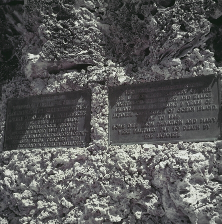 Close up of the bronze plaques on the World War II monument to natives of the Gilbert and Ellice Islands