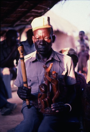 Sculptor holding items he&#39;d made for the Kaputa royal lineage, Kaputa village