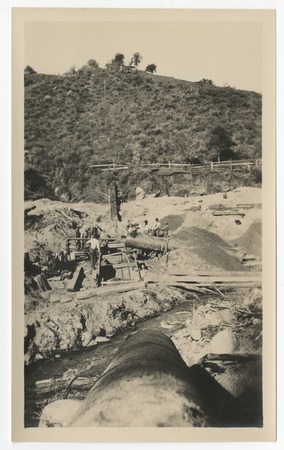 Laying steel pipe for repairs to the San Diego flume following the 1916 flood