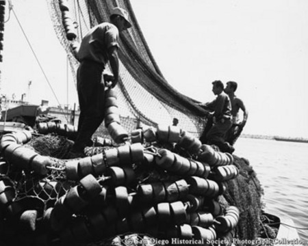 Fishermen loading nets on to boat at Embarcadero