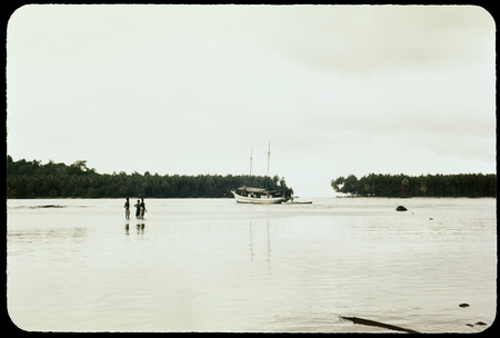 Boat and people on a reef
